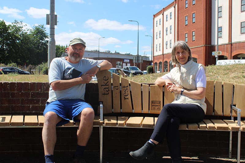 Tim Germain and Annett Thompson 'take a rest' on the new Greener Ipswich bench. Photo: Concertus Design and Property Consultants